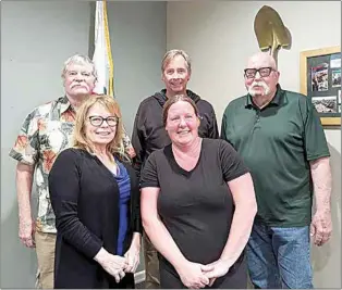  ?? CLAUDIA ELLIOTT / FOR TEHACHAPI NEWS ?? Don Napier, far right, was appointed to fill a vacancy on the Board of Directors of Stallion Springs Community Services District on April 16. He’s pictured here with other members of the board. Clockwise, from the back row, are Directors Neil Record and Ben Dewell, Napier, Vice President Leslie Wellman and President Teresa Sasnet.