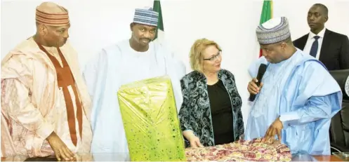  ?? Photo: Sokoto Govt. House ?? From right: Governor Aminu Waziri Tambuwal of Sokoto State presents gifts to Dr. Linda Robertson of Kent University’s Gerald Read Centre for Internatio­nal and Intercultu­ral Education, during her visit to Government House in Sokoto yesterday. With them...