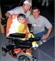  ??  ?? Patrick the Superhero, with his parents, Cindy and Michael Sharrock.