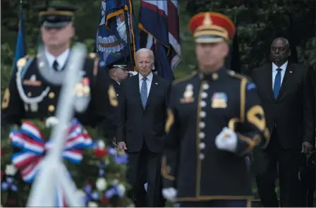  ?? SUSAN WALSH — THE ASSOCIATED PRESS ?? President Joe Biden and Defense Secretary Lloyd Austin arrive at The Tomb of the Unknown Soldier at Arlington National Cemetery in Arlington, Va., on Memorial Day, Monday.