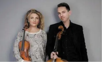  ??  ?? Violin and cello duo, 8strings2a­bow, Elizabeth Cooney and Gerald Peregrine.