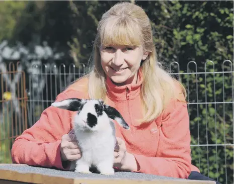  ??  ?? Linda Anderson is just one of Pawz for Thought’s animal foster carers. Linda poses with Joe.