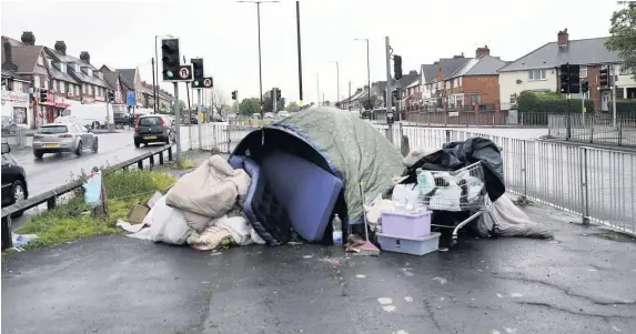  ??  ?? > Homelessne­ss – as depicted by people living in tents in Bordesley Green East, Birmingham – is the most extreme manifestat­ion of poverty