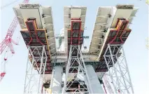  ?? JOHN MAHONEY ?? The three sections of the new Champlain Bridge are seen from underneath the main structure on the St. Lawrence River.