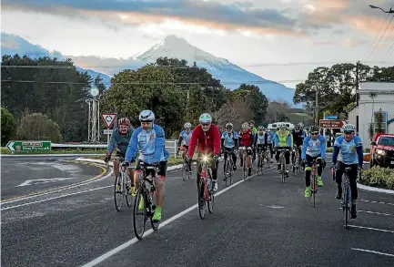  ?? GRANT MATTHEW/STUFF ?? Riders enter the small Taranaki township of Okato on the 2017 Cycle of Hope, a cycle tour around Taranaki supporting Daffodil Day.