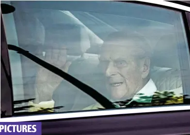  ??  ?? Good spirits: Duke waves as he arrives back at Windsor Castle after 2 days in hospital
