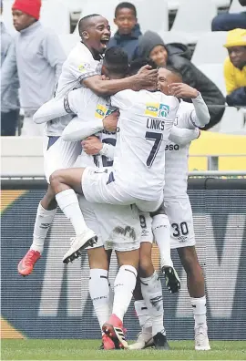  ?? Picture: Backpagepi­x ?? GOLDEN GOAL. Cape Town City’s Taariq Fielies is swamped by teammates after he scored in their MTN8 semifinal against Sundowns at Cape Town Stadium on Saturday.