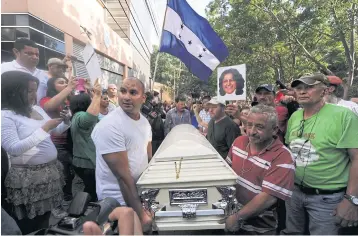  ?? AFP ?? Relatives and friends carry the coffin of murdered indigenous activist Berta Caceres during her funeral in La Esperanza, 200 km northwest of Tegucigalp­a, on March 3.