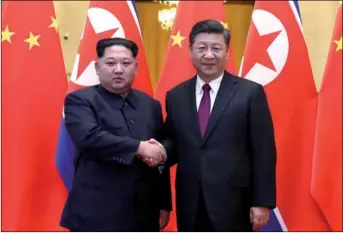 ?? JU PENG / XINHUA ?? Xi Jinping, general secretary of the Central Committee of the Communist Party of China and Chinese president, Kim Jong-un, chairman of the Workers’ Party of Korea and chairman of the State Affairs Commission of the Democratic People’s Republic of...
