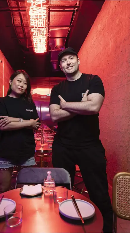  ?? Antonie Robertson / The National ?? Lynn Lin, left, and Lobito Brigante, owners of the Asianinspi­red restaurant and music space Electric Pawn Shop