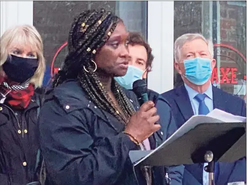  ?? Grace Duffield / Hearst Connecticu­t Media ?? Fatou Niang, founder of STAR, spoke at a candle-lit vigil that was held for Asian American and Pacific Islanders on Wednesday at Saxe Middle School in New Canaan. Behind her to the right is Susan Serven who read a letter from her daughter about a “disturbing incident” her daughter of Chinese heritage experience­d. To the left is Rep. Will Haskell, and First Selectman Kevin Moynihan.