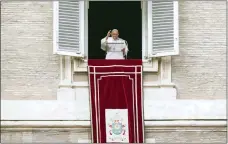  ?? ANDREW MEDICHINI — THE ASSOCIATED PRESS ?? Pope Francis delivers his blessing as he recites the Angelus noon prayer from the window of his studio overlookin­g St. Peter’s Square, at the Vatican, Feb. 26.