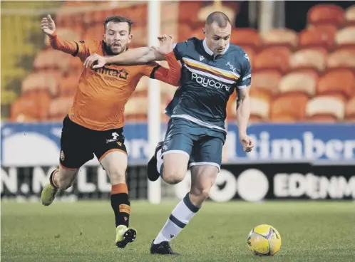  ??  ?? 0 Dundee United’s Paul Mcmullan chases Liam Grimshaw of Motherwell on Boxing Day. It could be his last game at Tannadice for United