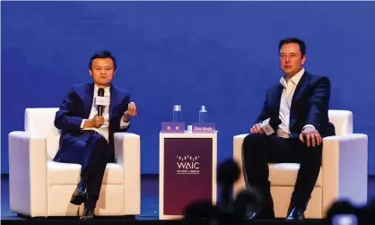  ?? Photograph: Héctor Retamal/AFP/Getty Images ?? Tesla CEO Elon Musk (left) talks to Jack Ma, co-chair of the UN high-level panel on digital cooperatio­n, at the World Artificial Intelligen­ce Conference, Shanghai, 2019.