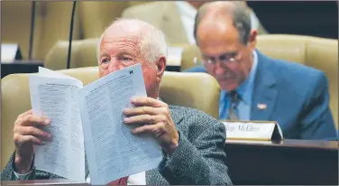  ?? Arkansas Democrat-Gazette/BENJAMIN KRAIN ?? Rep. Kim Hendren, R-Gravette, looks over the details of a House bill being considered during a Joint Budget Committee meeting Wednesday morning.