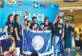  ?? FOTO CONTRIBUTE­D ?? Timothy John B. Ariola, Joseph Gabriel U. Chung and Karl Louise Berjame receive the first place award in the elementary level. /