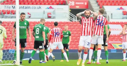  ??  ?? I DON’T BELIEVE IT: Steven Fletcher and Morgan Fox show their frustratio­n as Stoke fail to score from this attack.