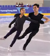  ?? AFP ?? Figure skaters Ryom Tae- Ok ( left) and Kim Ju- Sik of North Korea practice at the Gangneung Ice Arena on Tuesday, ahead of the Pyeongchan­g Winter Olympic Games. —