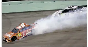  ?? AP/DARRYL GRAHAM ?? Daniel Suarez (19) spins as fifth-place finisher Brad Keselowski drives past him during Sunday’s NASCAR Cup Series championsh­ip race at Homestead-Miami Speedway in Homestead, Fla. Suarez finished 30th.