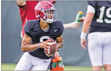  ?? Associated Press ?? On the move: Alabama quarterbac­k Bryce Young (9) rolls out on a passing drill during the NCAA college football team's practice earlier this month in Tuscaloosa, Ala.