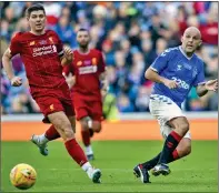  ??  ?? FIERCE COMPETITOR­S: Rae (right) had a ‘wee nibble’ at Gerrard during a recent Rangers v Liverpool legends game