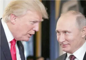  ?? — AFP ?? In this file photo taken on November 11, 2017 US President Donald Trump with Russian President Vladimir Putin during the APEC leaders’ summit in the Vietnamese city of Danang.