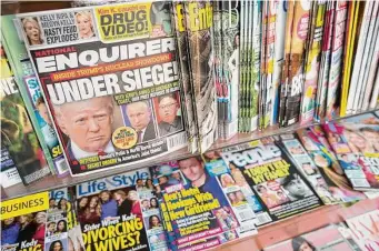  ?? Associated Press file photo ?? In late 2018, the parent company of the National Enquirer and other publicatio­ns admitted to engaging in a journalist­ically dubious practice in order to help Donald Trump become president.