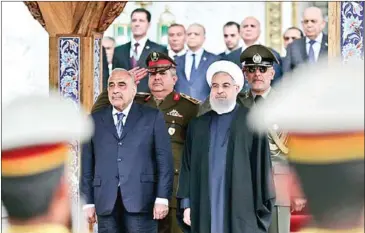  ?? AFP ?? Iranian President Hassan Rouhani (front right) attends a ceremony with Iraqi Prime Minister Adel Abdel Mahdi (left) in Tehran earlier this year.