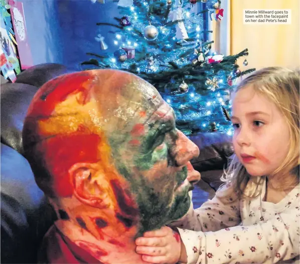  ??  ?? Minnie Millward goes to town with the facepaint on her dad Pete’s head
