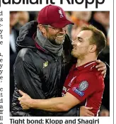  ?? AFP ?? Tight bond: Klopp and Shaqiri embrace on the touchline