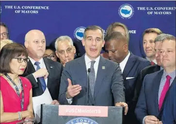  ?? Mark Wilson Getty Images ?? LOS ANGELES Mayor Eric Garcetti, speaking at the mayors conference in Washington, derided as empty threats the Trump administra­tion’s letters to 23 states, cities and counties over their sanctuary policies.