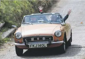  ??  ?? As always, classic owners in attendance were encouraged to pit their cars against the punishing inclines of Brooklands’ infamous Test Hill; this 1972 MGB roadster was one of the fortunate vehicles to make it up successful­ly and unscathed.