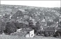  ??  ?? MASS GATHERING: Main Picture, Holmfirth Feast sing May 31, 1908. Above from left, Holmfirth Parish Church; the wreckage from a bus accident in October 1947; a bygone scene at Holmfirth railway station; a view from Victoria Park over Holmfirth.