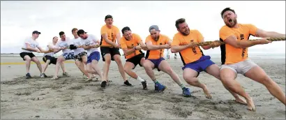  ??  ?? Some of this year’s Rose escorts take part in a tug-of-war during the escort bootcamp in Ballyheigu­e on Saturday. Quite how this particular skill will be put to use during the festival, sadly, remains unclear.