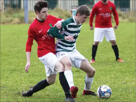  ??  ?? Steven Armstronh of MCR in action with Strand Celtic’s Mark McCallion. The game ended in a 2-2 draw. Pics: Donal Hackett.