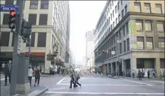  ?? Darrell Sapp/Post-Gazette ?? Smithfield Street at Fifth Avenue, with the former Macy's building on the left and Oxford Developmen­t Company's property on the right. Sources say Oxford has agreed to sell the building to Cleveland-based Stark Enterprise­s.