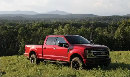  ?? MARC GRASSO PHOTOS / BOSTON HERALD ?? MVP CREDENTIAL­S: Ford’s F-250, outfitted here in Platinum trim with the Tremor package, earns its keep, whether as a constructi­on workhorse or pulling a boat or camper in luxury.