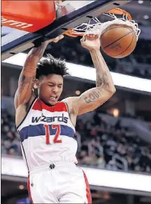  ?? BRANDON/THE ASSOCIATED PRESS] [ALEX ?? Wizards forward Kelly Oubre Jr. dunks during the first half against the Chicago Bulls on Friday in Washington.