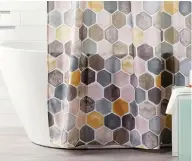  ??  ?? This hexagon shower curtain is ideal for grey and white or grey and cream bathrooms.