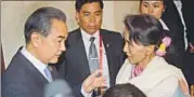  ?? AFP FILE ?? Chinese foreign minister Wang Yi (left) meets Myanmar's first state councellor Aung San Suu Kyi in Vientiane on July 24.