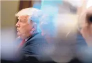  ?? ANDREW HARNIK /ASSOCIATED PRESS ?? President Donald Trump listens as he attends a Cabinet meeting in the Cabinet Room of the White House on Thursday.