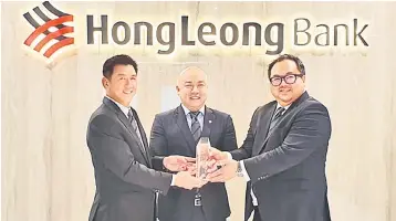  ??  ?? (From left) HLB Personal Financial Services managing director Charles Sik, Teoh and Yow celebratin­g the proud achievemen­t.