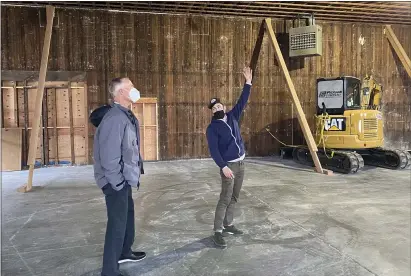  ?? ISABELLA VANDERHEID­EN — TIMES-STANDARD ?? Dick Taylor Craft Chocolate co-owner Dustin Taylor took Rep. Jared Huffman on a tour of their new facility at the foot of E Street on Eureka’s Waterfront. The new facility is slated to open late this year.