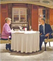  ?? EFE/GUIDO BERGMANN ?? Merkel e Obama conversam descontrai­damente no Hotel Adlon