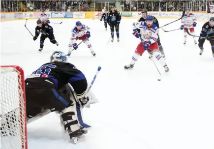  ?? CITIZEN PHOTO BY JAMES DOYLE ?? Prince George Spruce Kings defenceman Chays Ruddy breaks in on Wenatchee Wild goaltender Austin Park on Monday night at Rolling Mix Concrete Arena.