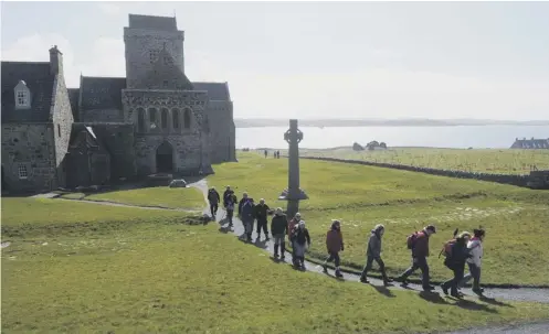  ??  ?? 0 Iona has attracted pilgrims since St Columba arrived to found what became one of the most influentia­l monasterie­s in the British Isles