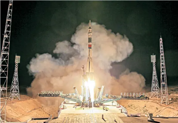  ??  ?? The Soyuz MS-13 spacecraft carrying three astronauts, Roscosmos’s Alexander Skvortsov, Andrew R Morgan of Nasa and Luca Parmitano of the ESA, lifts off to the Internatio­nal Space Station from Kazakhstan on Saturday