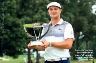  ??  ?? Bryson Dechambeau celebrates with the winner's trophy after the final round of The Northern Trust