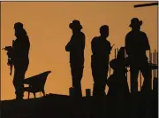  ?? (AP/Anjum Naveed) ?? Pakistan police commandos stand guard on a rooftop while they observe the area to ensure the security of the rally of Pakistan’s former Prime Minister Imran Khan’s “Pakistan Tehreek-e-Insaf” party Saturday in Rawalpindi, Pakistan.