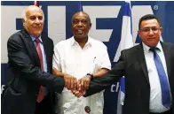  ?? (Reuters) ?? JIBRIL RAJOUB (left), president of the Palestinia­n Football Associatio­n, Tokyo Sexwale (center), chairman of the FIFA Monitoring Committee Israel-Palestine and Israel Football Associatio­n president Ofer Eini shake hands following a news conference in...